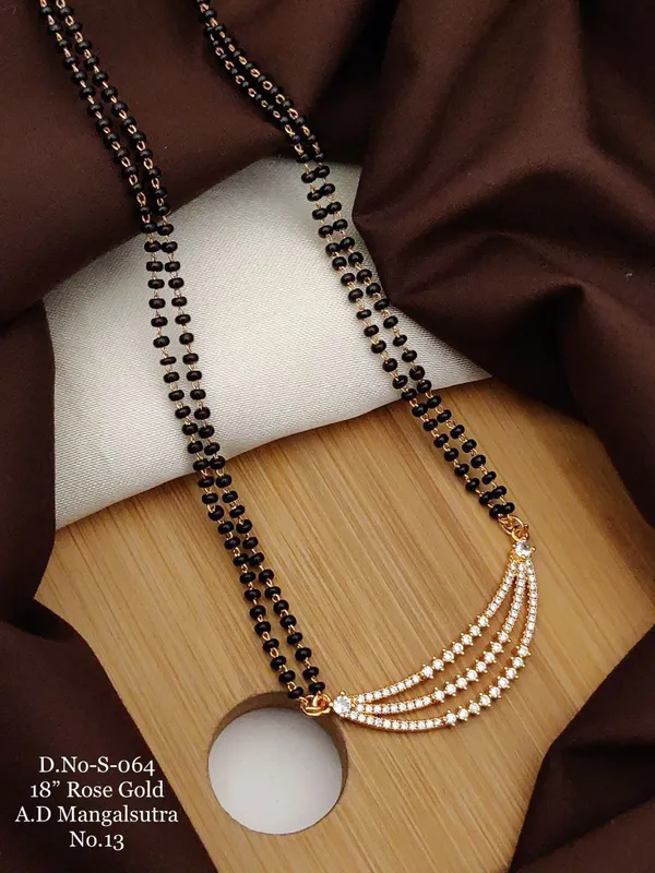 https://d1311wbk6unapo.cloudfront.net/NushopCatalogue/tr:f-webp,w-600,fo-auto/D-NO-S-064 ROSE GOLD AD 18 FANCY MANGALSUTRA_1684936625849_0v4ulqh5n6pi96g.jpg__Ketmera